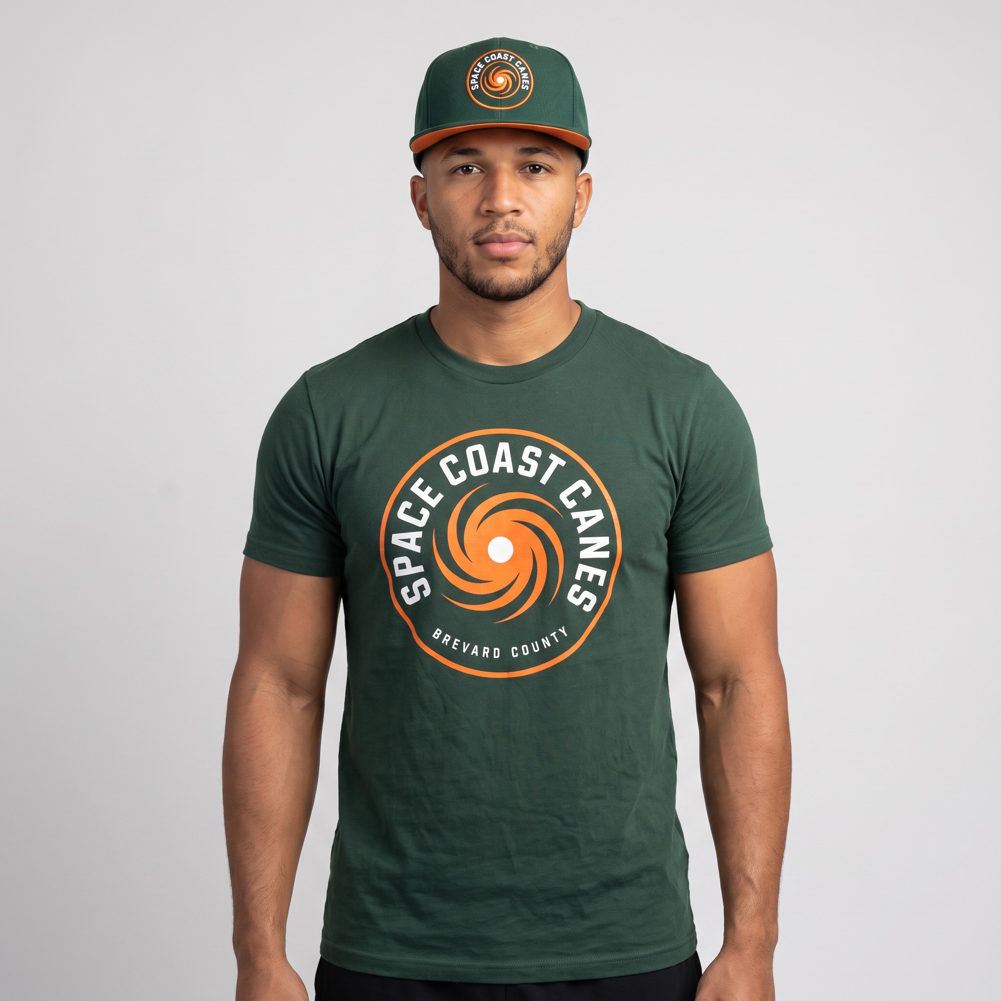Space Coast Canes member wearing the green hurricane badge t-shirt and matching green snapback hat