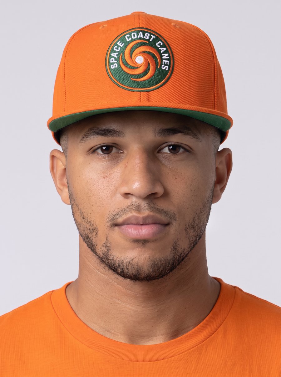 Space Coast Canes member wearing the orange hurricane badge snapback hat and matching orange t-shirt