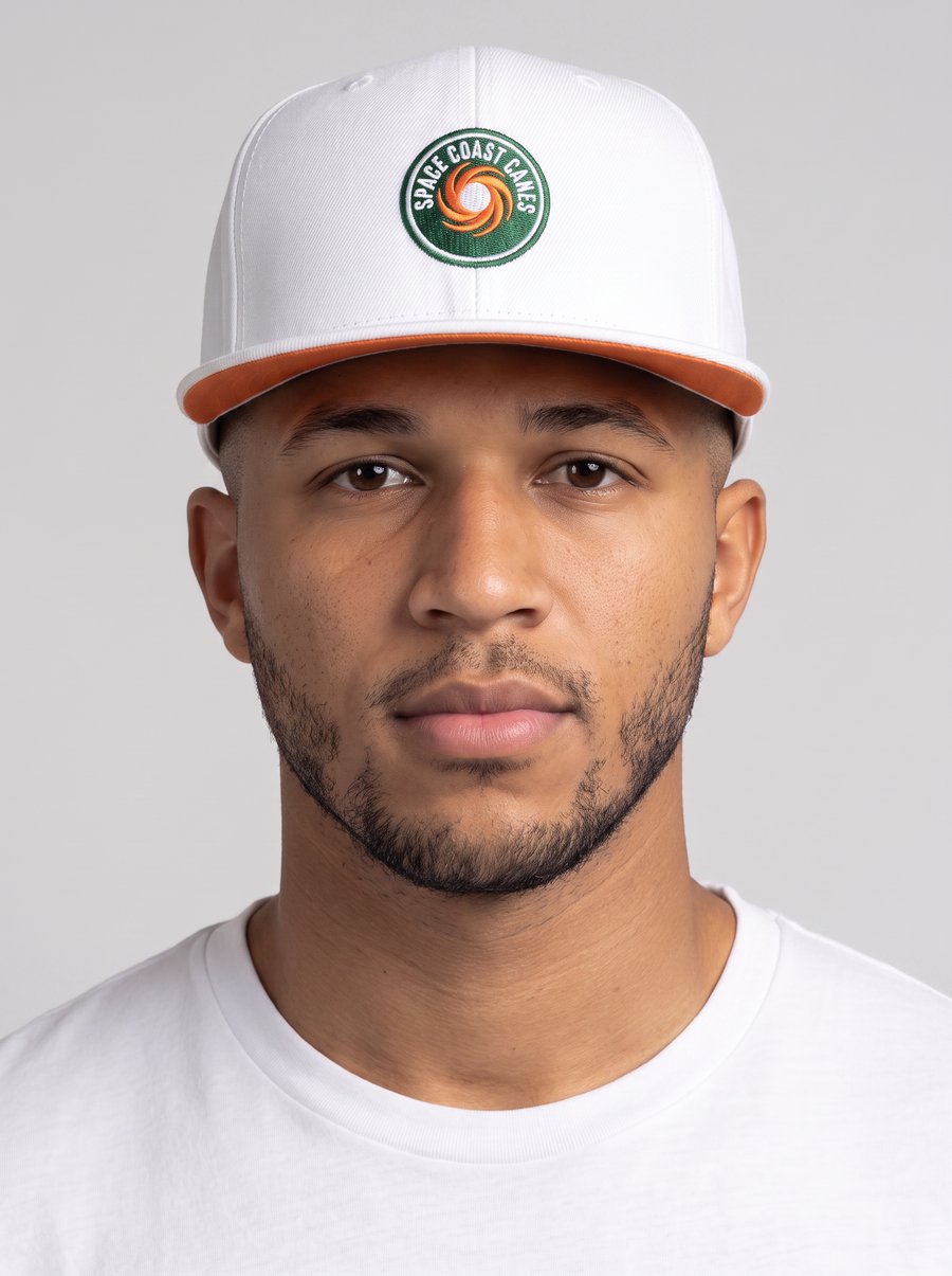 Space Coast Canes member wearing the white hurricane badge snapback hat and matching white t-shirt